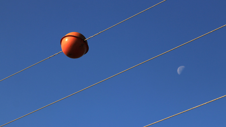 Power line ball and moon