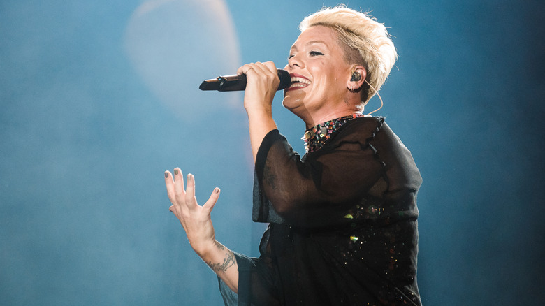 Pink performing with visible earpiece