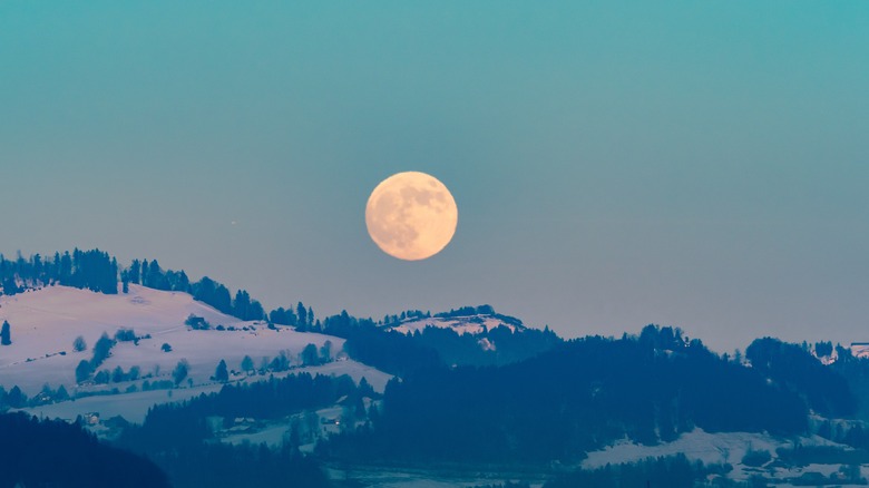 the full moon over snow