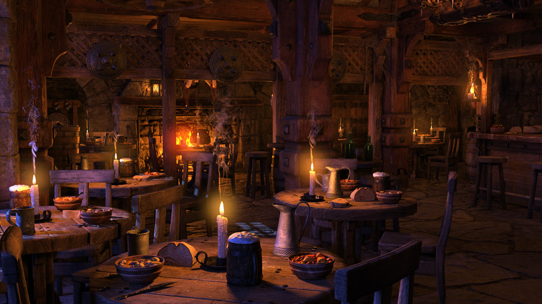 Medieval tavern lit by candlelight