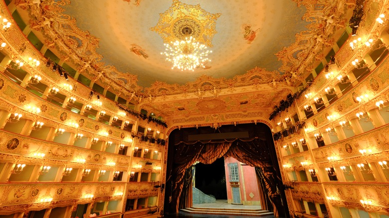 Italian opera house lit by candles