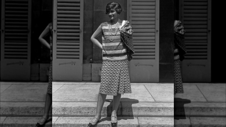 Coco Chanel standing