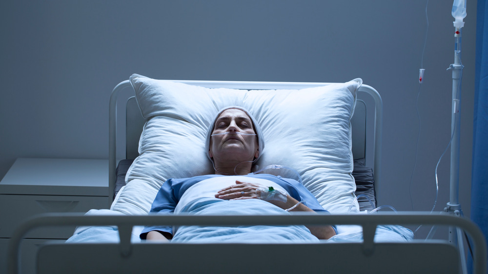 Patient lying in hospital bed