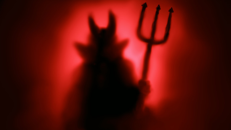 devil costume with pitchfork
