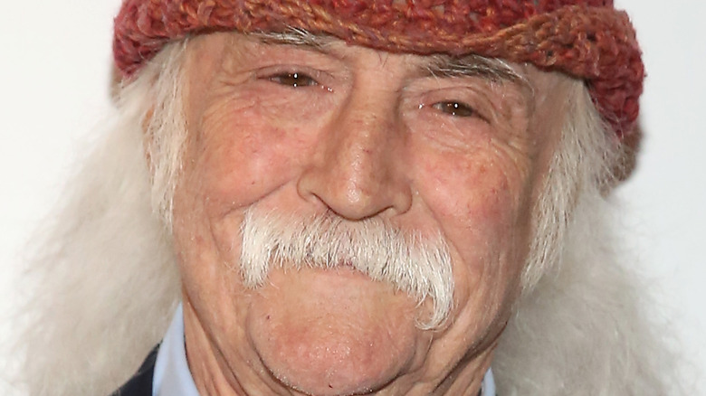 David Crosby smiling red hat