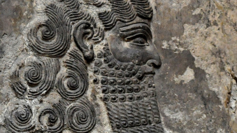 Alabaster bas-relief depicting Lahmu, one of the Assyrian protective spirits