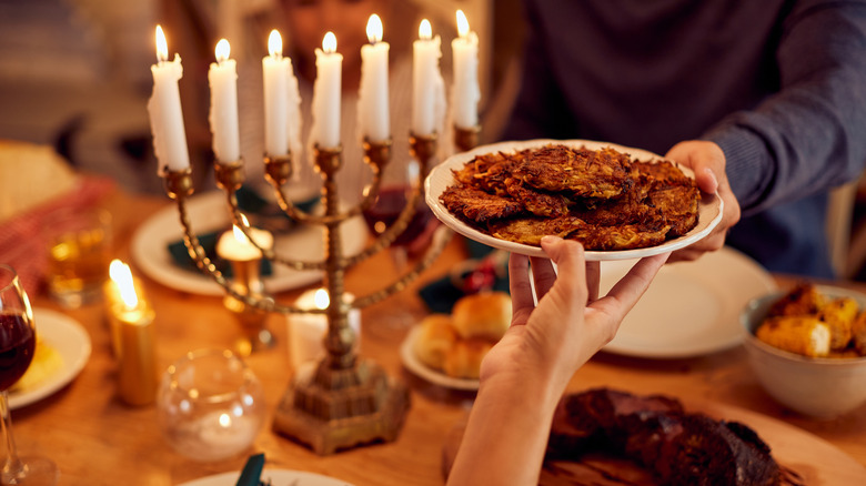 Passing latkes to someone