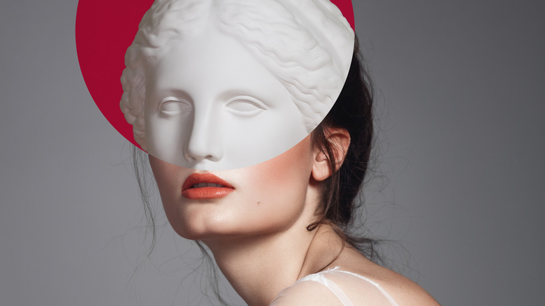Classical sculpture visible through head