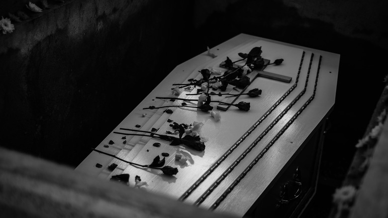 Casket burial with flowers