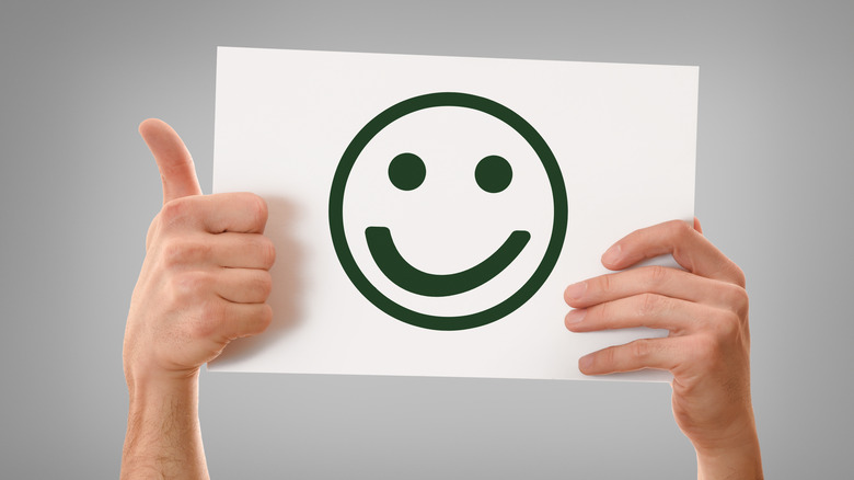Thumbs up and smiley face