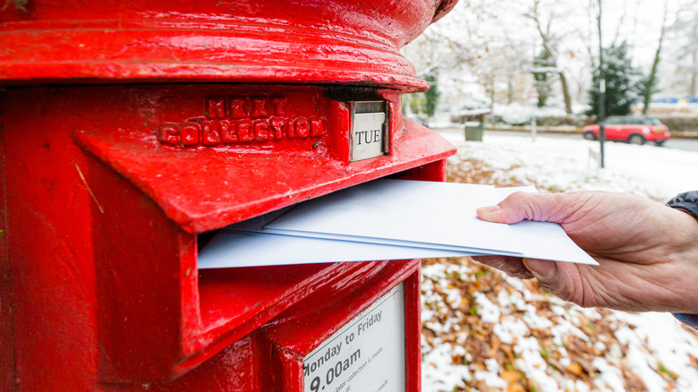 Elderly person depositing mail