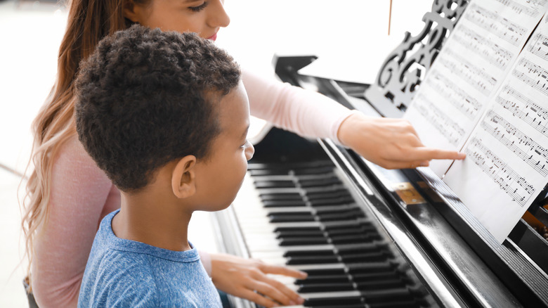Music teacher with student