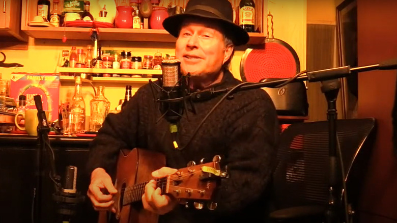 Jerry Hannan singing into microphone