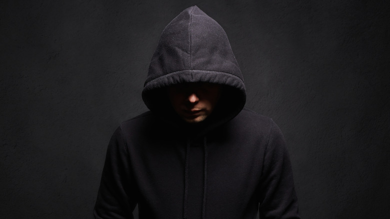 dark hooded figure