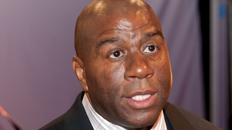 Magic Johnson wearing a suit