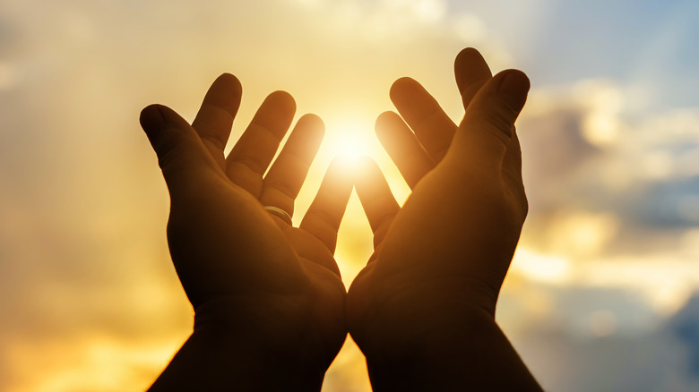 Hands raised to the sky