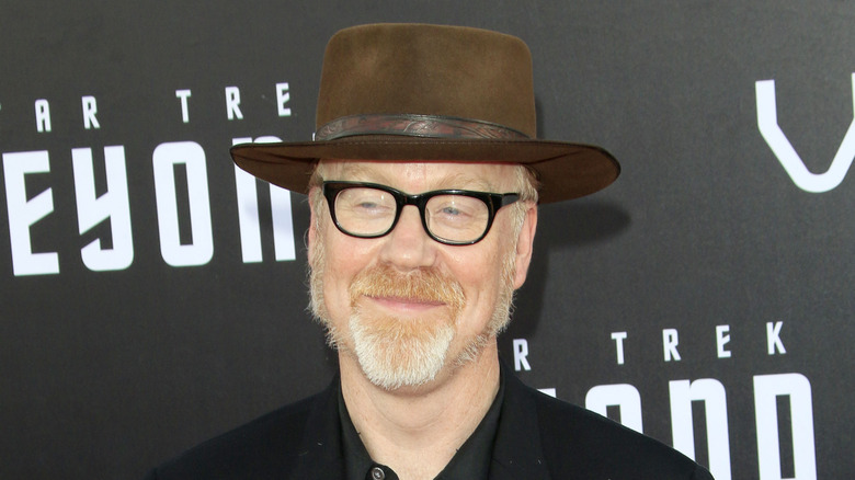 Adam Savage smirking in large hat
