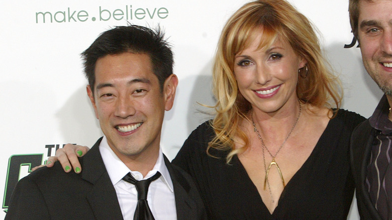 Grant Imahara and Kari Byron smiling at event