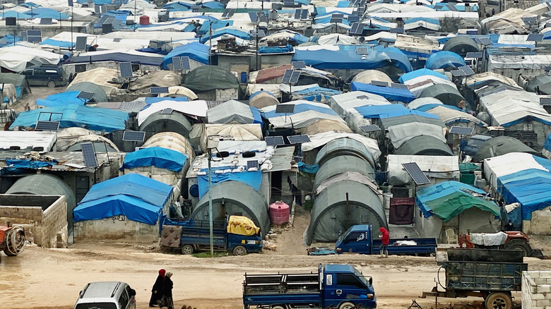 rows of tents and solar panals Syrian refugee camp