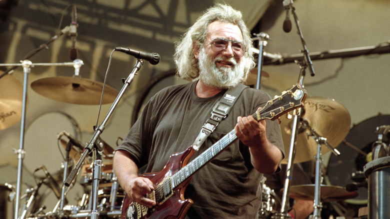 Jerry Garcia performing in concert with The Grateful Dead