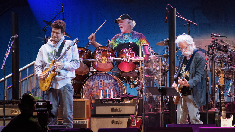 John Mayer, Bill Kreutzmann, and Bob Weir performing as Dead & Company