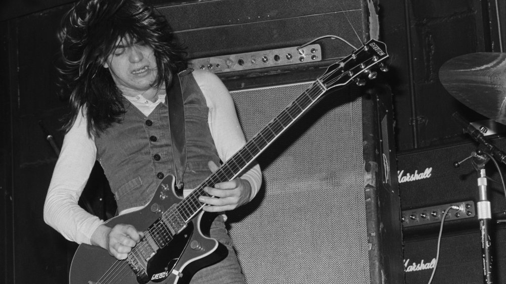 Malcolm Young playing guitar