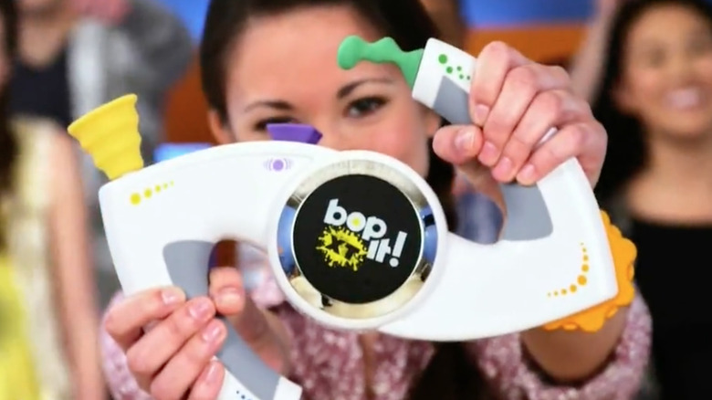 A Bop-It XT toy in a TV commercial