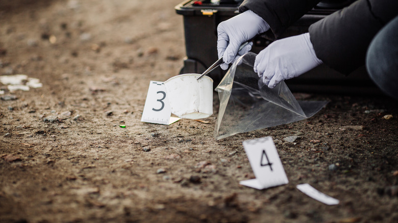 detective collecting evidence