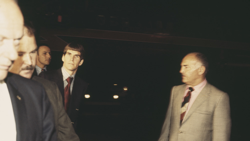Tex Watson escorted into court
