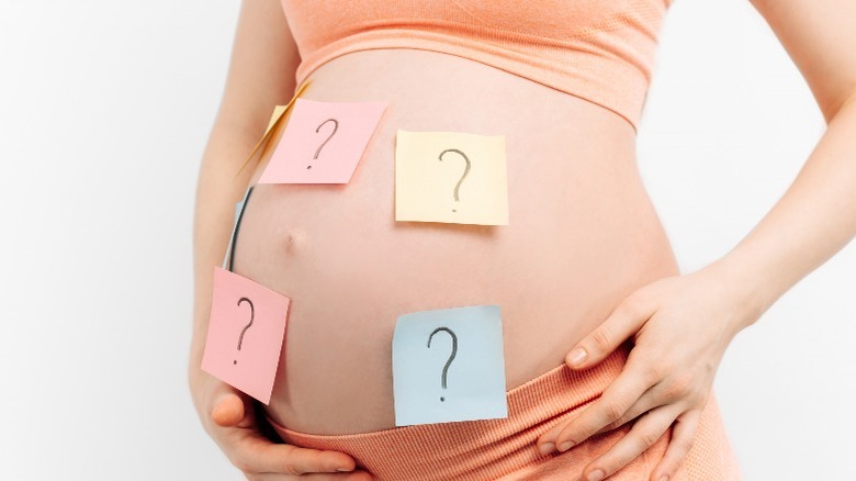 expectant mother question marks stomach
