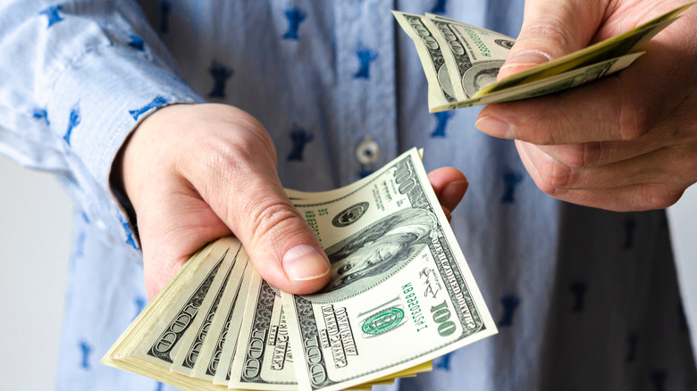 Man giving cash away