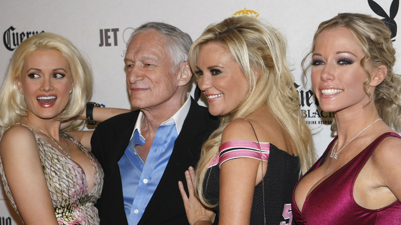 Hugh Hefner poses with Holly Madison, Bridget Marquardt, and Kendra Wilkinson