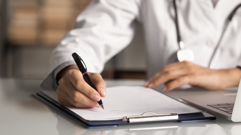 Doctor writing
