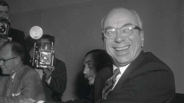Lewis Strauss writes something down