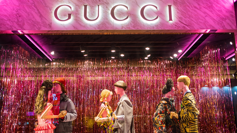 Gucci storefront with mannequins