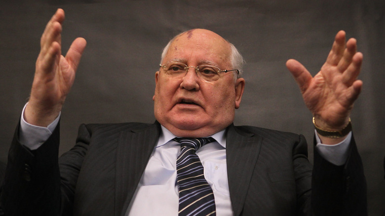 Mikhail Gorbachev with hands raised