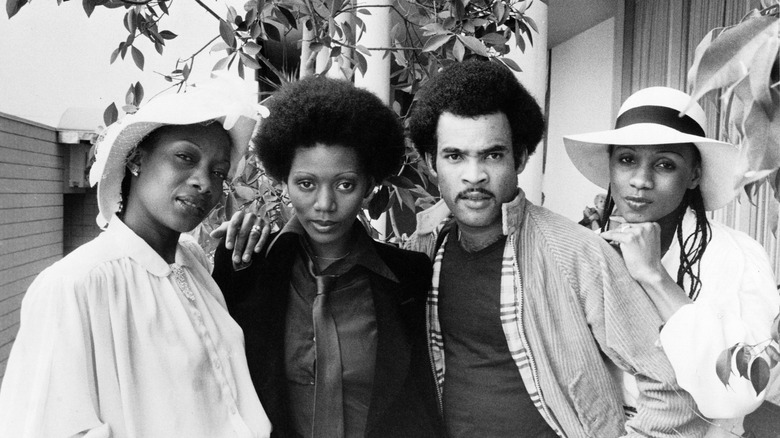 Boney M outdoors near tree