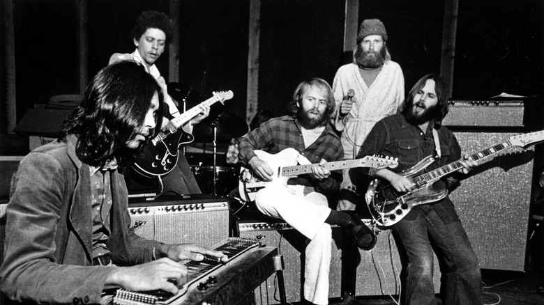 Ricky Fataar and Blondie Chapman performing with Al Jardine, Mike Love, and Carl Wilson of the Beach Boys