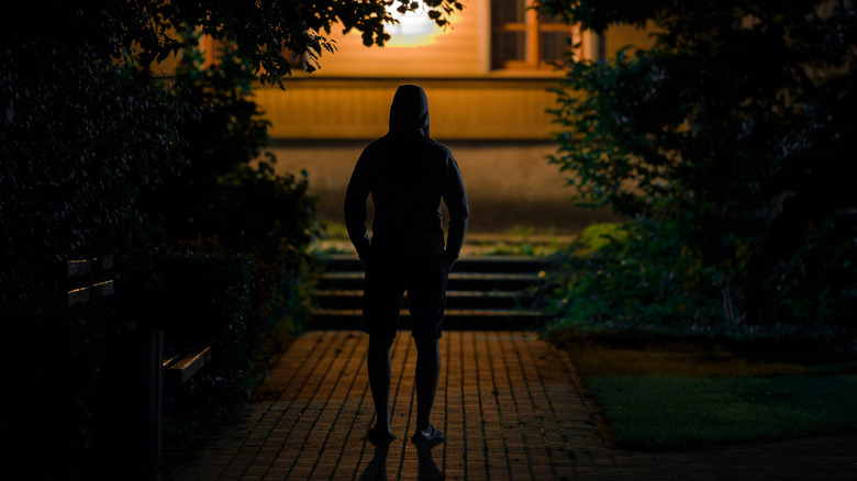 Man standing in shadow