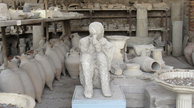 Preserved Pompeii granary, vessels, and cast
