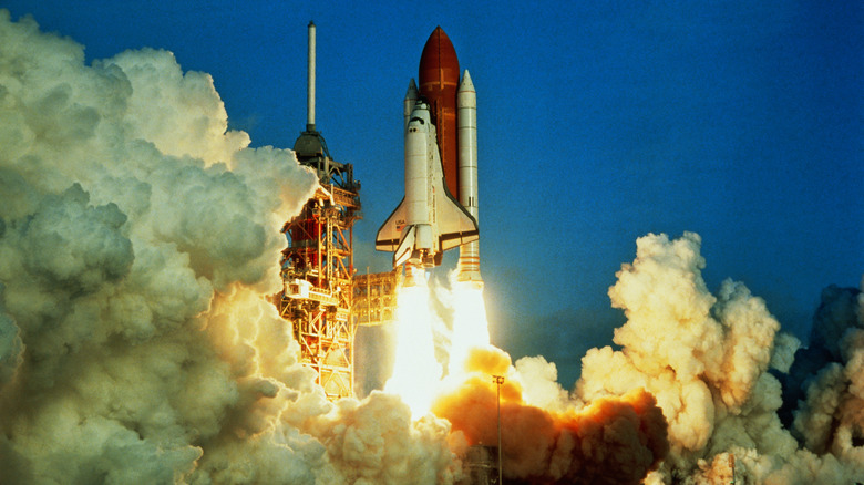 Space shuttle lifting off