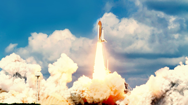 Space shuttle lifting off