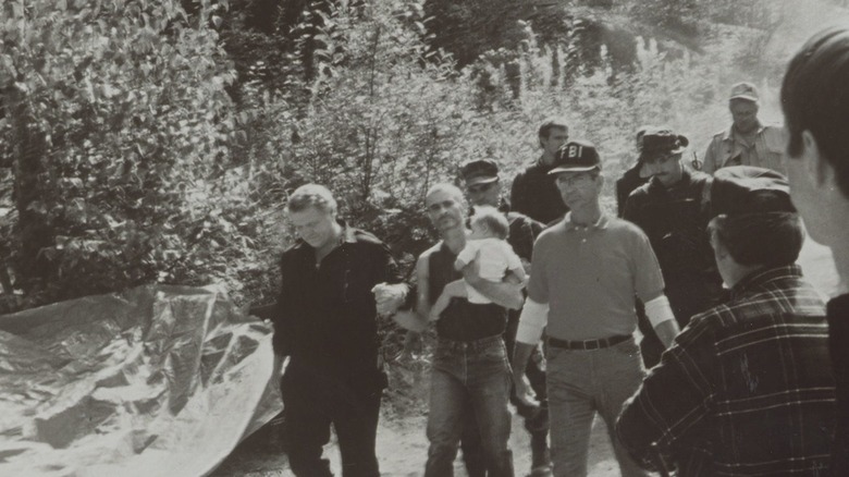 Randy Weaver escorted by police