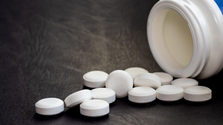 pills spilling out of a bottle