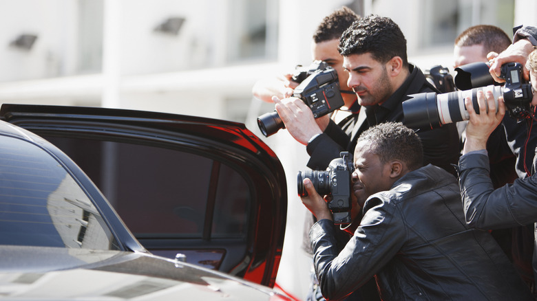 paparazzi taking pictures
