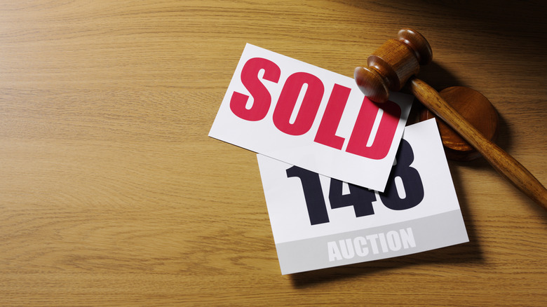 Auction gavel and sold sign