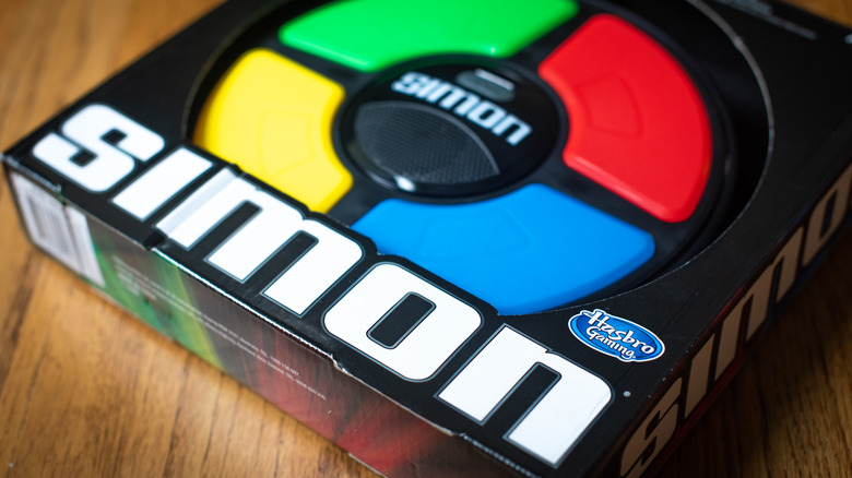 Simon game's box sitting on wooden table