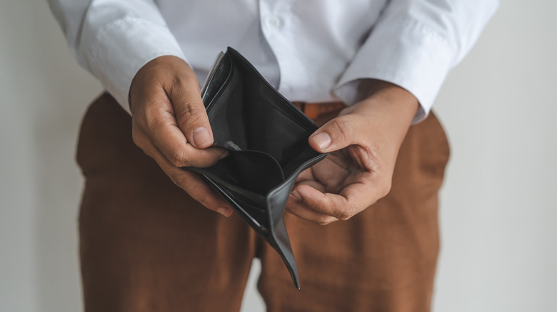 man with empty wallet