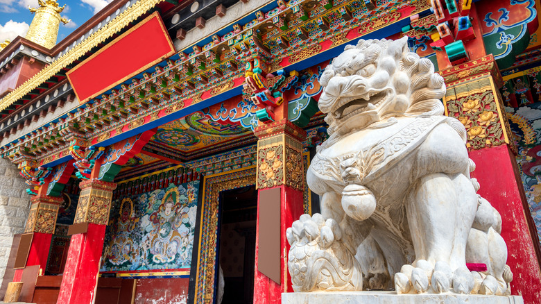 Chinese lion statue guarding temple