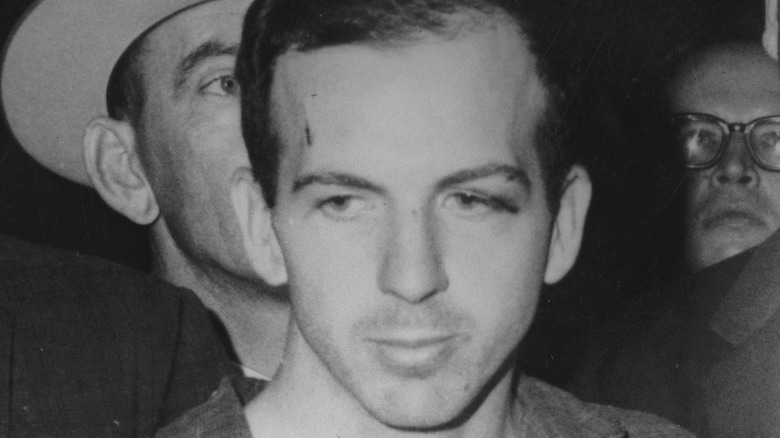 Lee Harvey Oswald escorted around